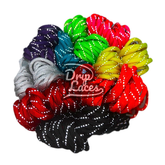 Assorted colorful shoelaces with 'Drip Laces' branding on a white background
