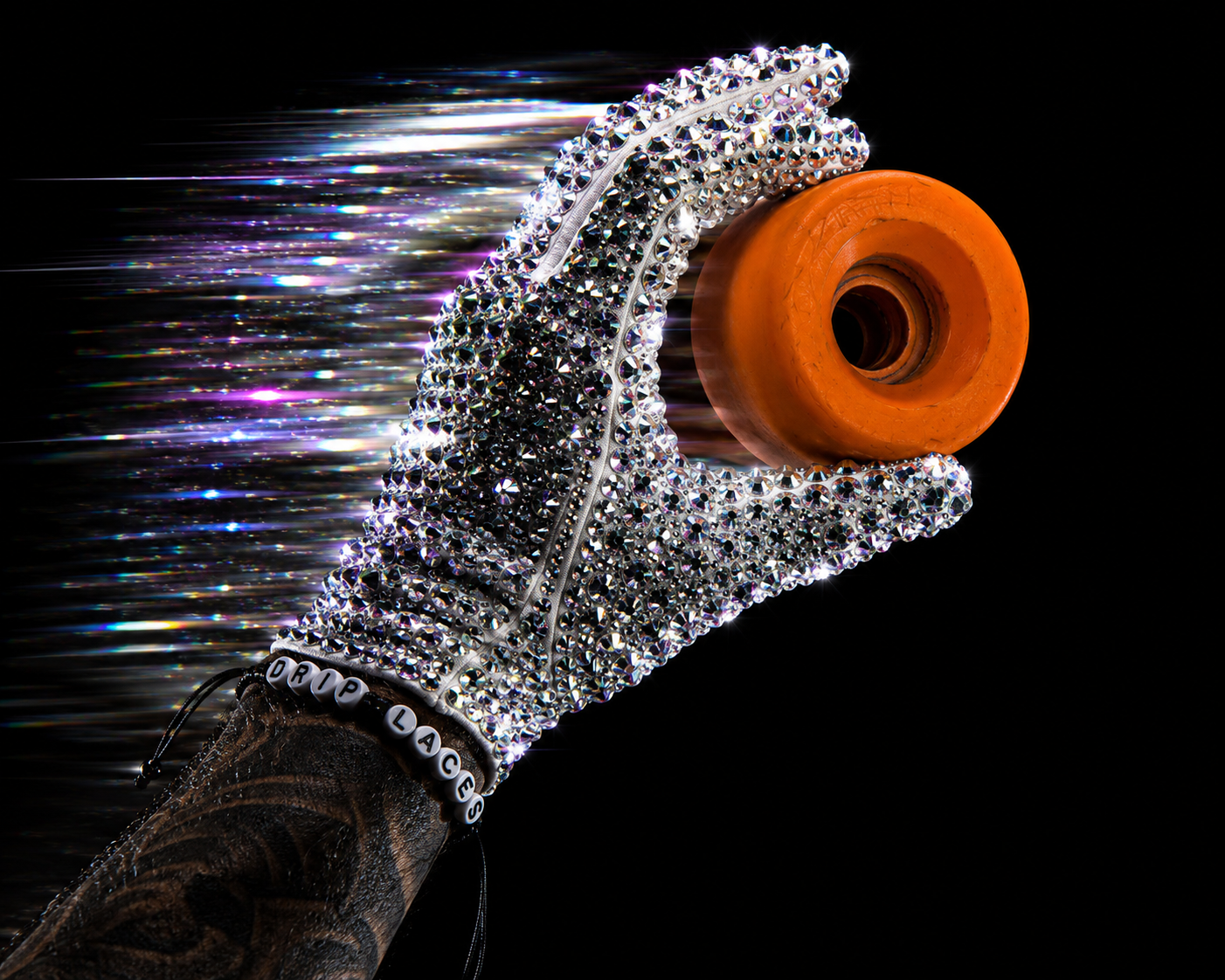 Rhinestones Gloves holding an Orange OG Vintage Vanathane Roller Skate Wheel